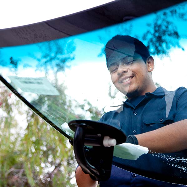 Man repairing auto glass